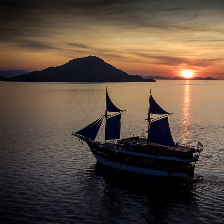 Luxury liveaboard Komodo at sunset
